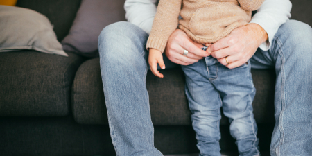 A father taking care of a boy for bladder abnormalities.